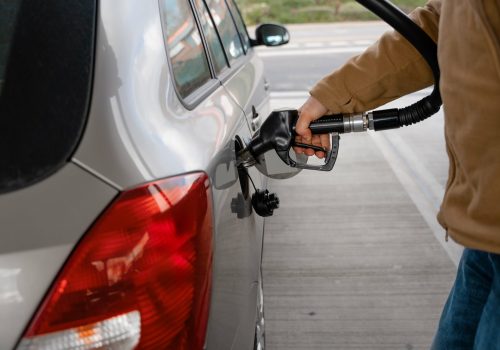 man-filling-fuel-tank-car-with-diesel-fuel-gas-station-close-up-as-cost-fuel-going-up-min