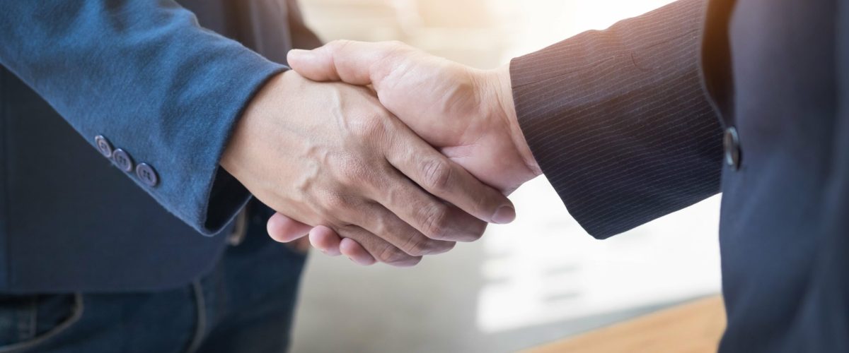 two-confident-business-man-shaking-hands-during-meeting-office-success-dealing-greeting-partner-concept-min